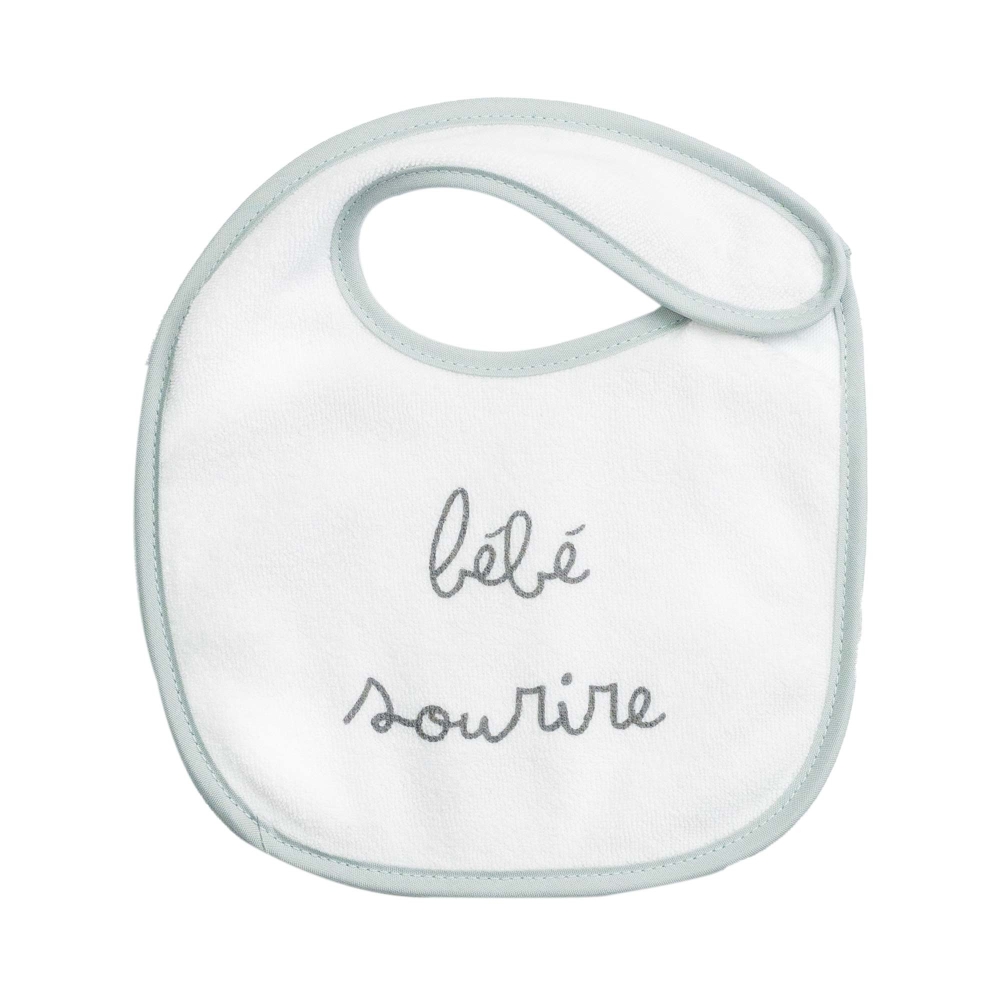 Smiling baby on this sage bib