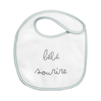 Smiling baby on this sage bib