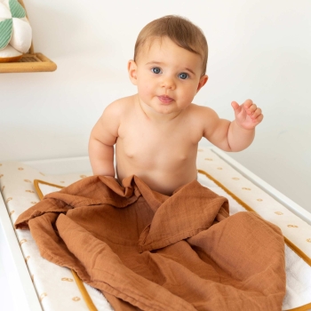 Baby in their terracotta swaddle Baby in their terracotta swaddle