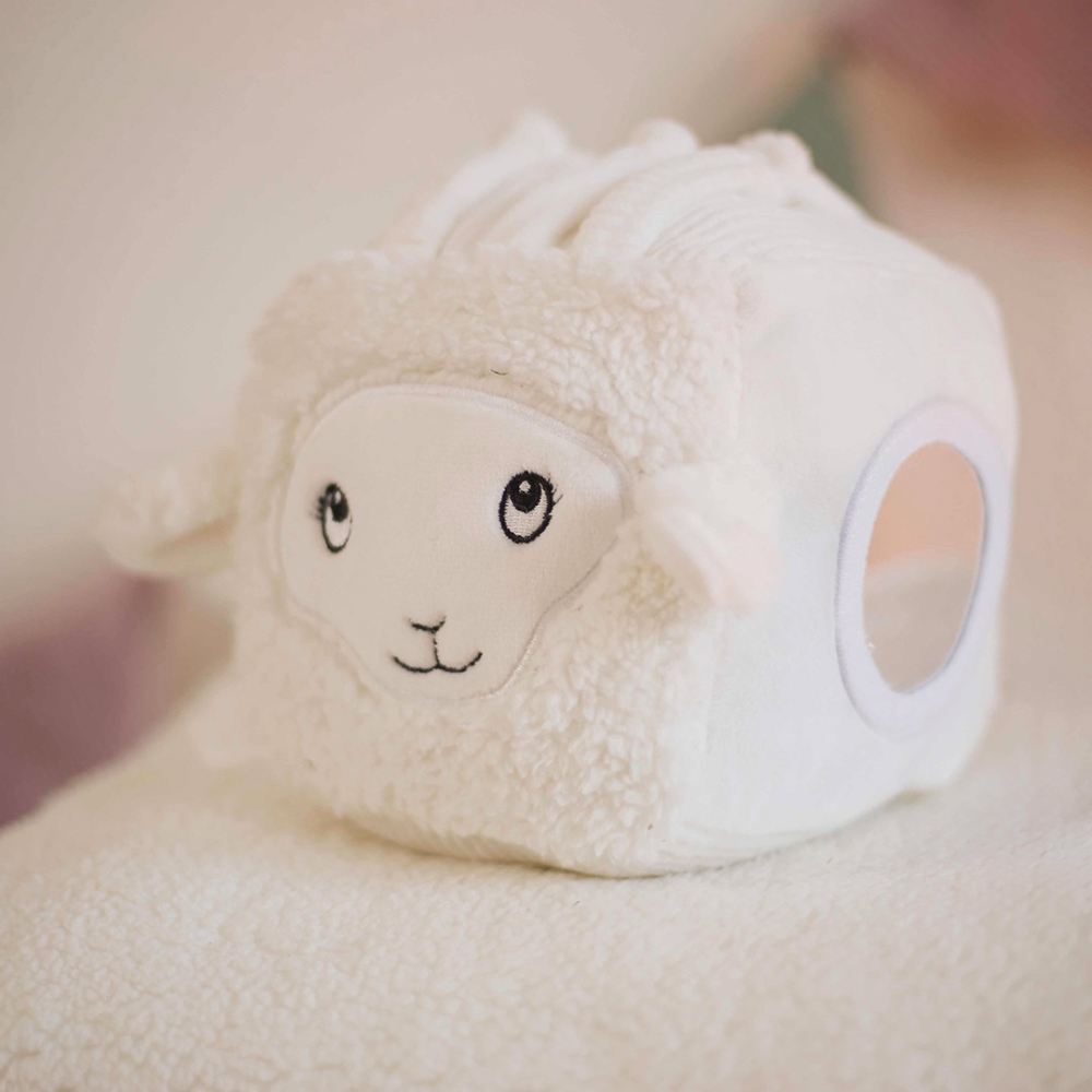 activity cube with Wooly the sheep's head and various activities of the early learning cube activity cube with Wooly the sheep's head and various activities of the early learning cube