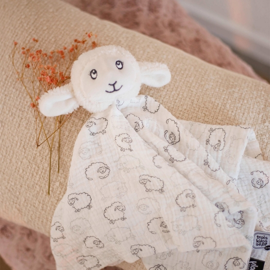 White sheep plush toy from the Wooly collection with an all-over sheep pattern.
