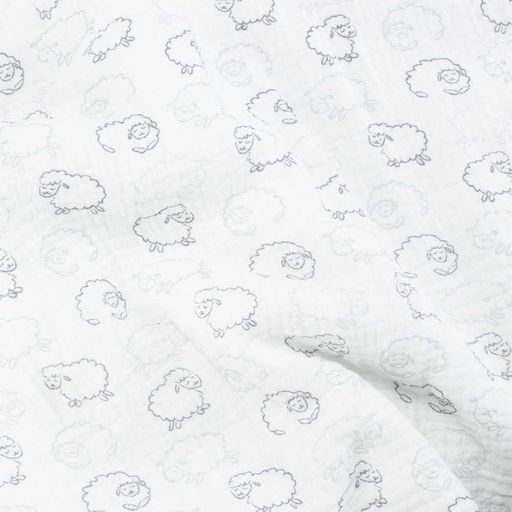 Zoom matière et motifs sur couverture blanche bébé Zoom matière et motifs sur couverture blanche bébé