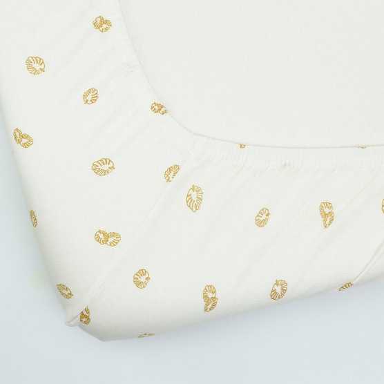 Ecru fitted sheet with leaf patterns
