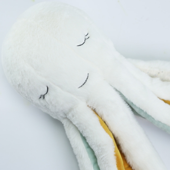 stuffed octopus named Poulpie in beige, mustard and sea green colors