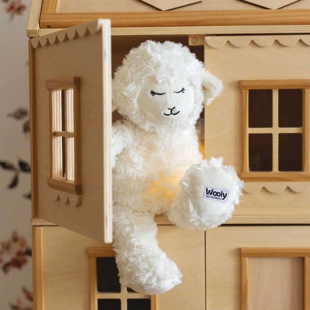 peluche branca com luz de presença e música