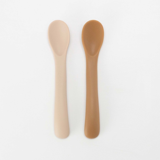 set of two beige and sand spoons