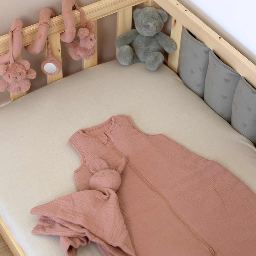 Baby sleep sack with developmental toys in crib Baby sleep sack with developmental toys in crib