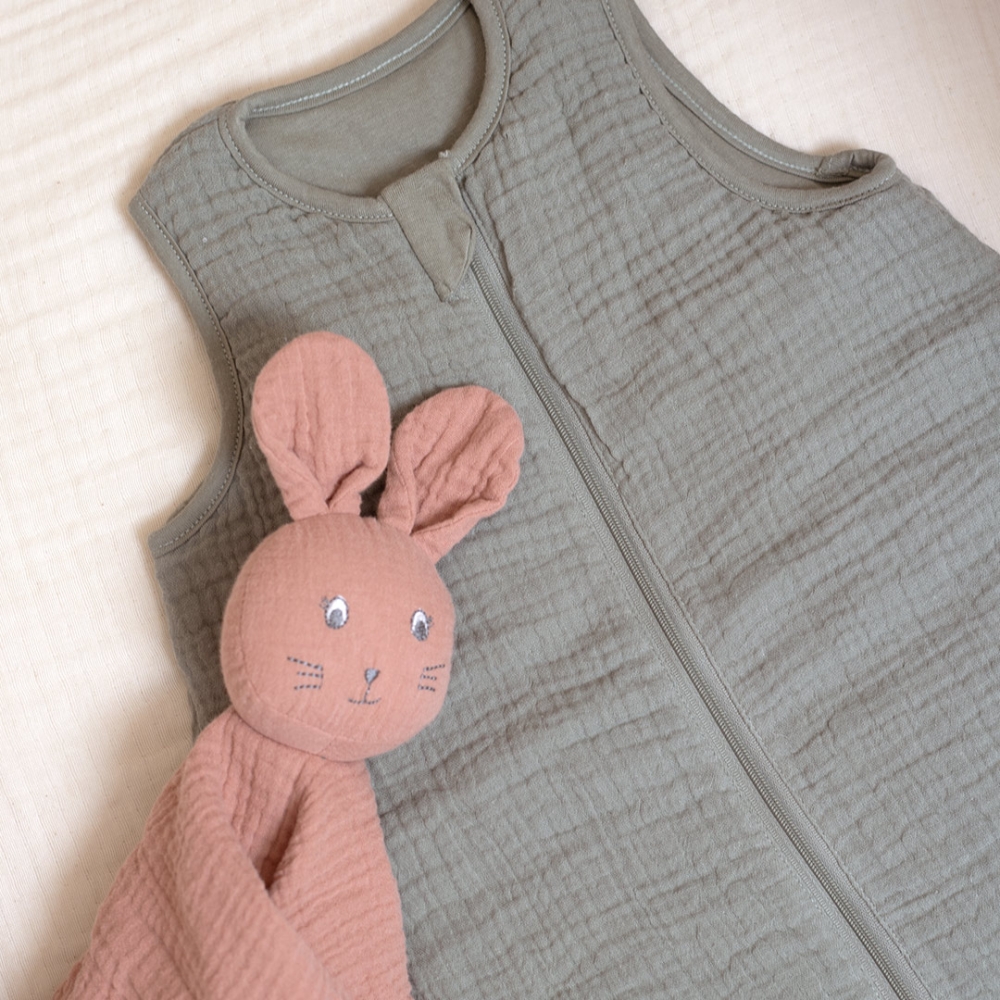 Close-up of clay green sleeping bag collar with zipper Close-up of clay green sleeping bag collar with zipper