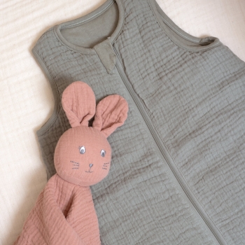 Close-up of clay green sleeping bag collar with zipper Close-up of clay green sleeping bag collar with zipper