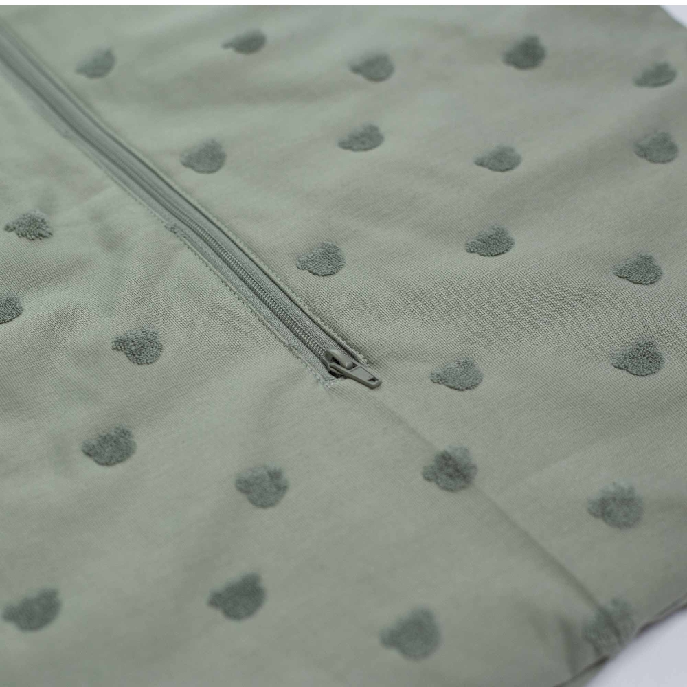 close-up of clay green sleeping bag fabric and pattern close-up of clay green sleeping bag fabric and pattern