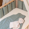 Crib rail guard placed on baby bed Crib rail guard placed on baby bed