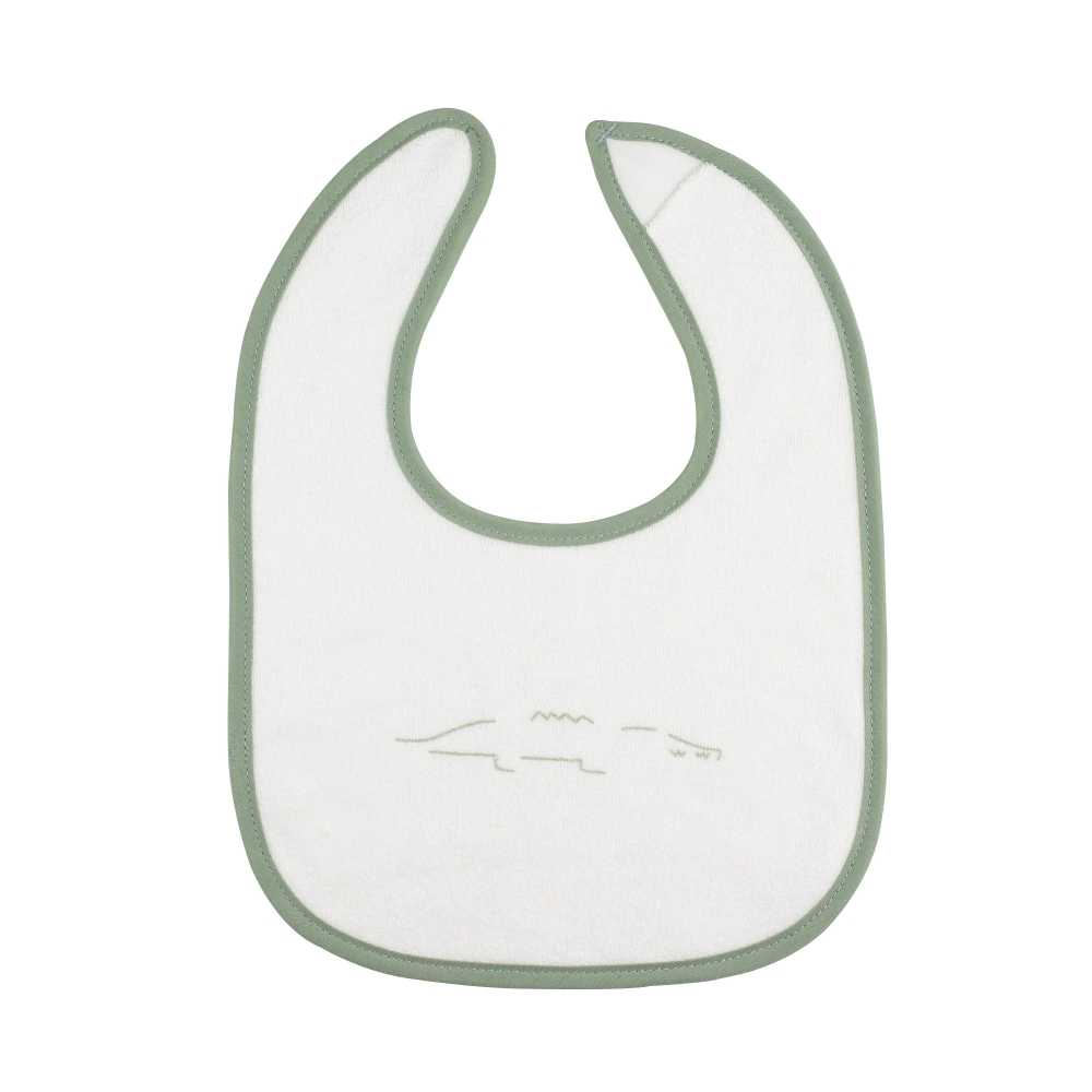 pormenor do babete branco com motivo de crocodilo pormenor do babete branco com motivo de crocodilo