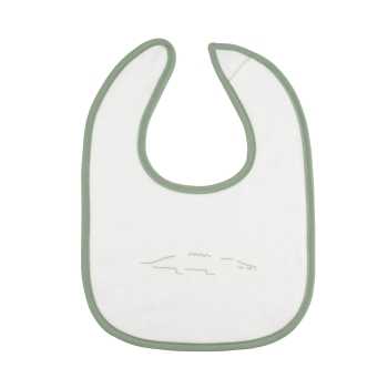 pormenor do babete branco com motivo de crocodilo pormenor do babete branco com motivo de crocodilo