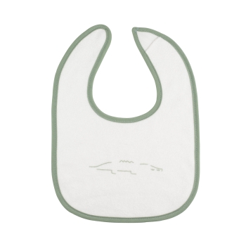 close-up of white bib with crocodile pattern