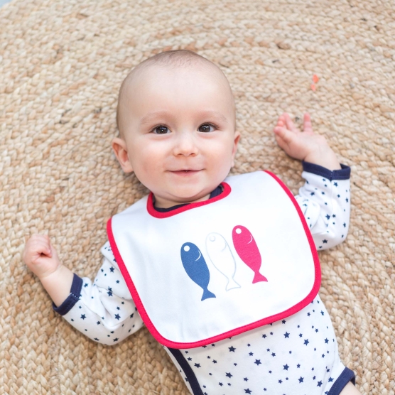 Small baby fish with its bib decorated with 3 small fish