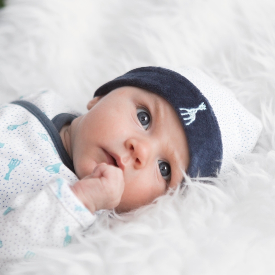 Baby warm and cozy with their Sophie the Giraffe hat