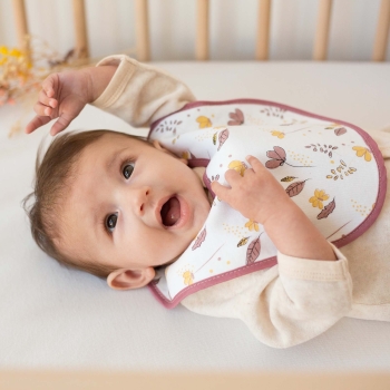 Pretty little happy girl with her flower bib Pretty little happy girl with her flower bib