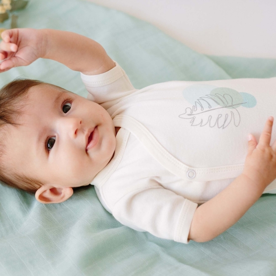 Set of two sage green short sleeve bodysuits
