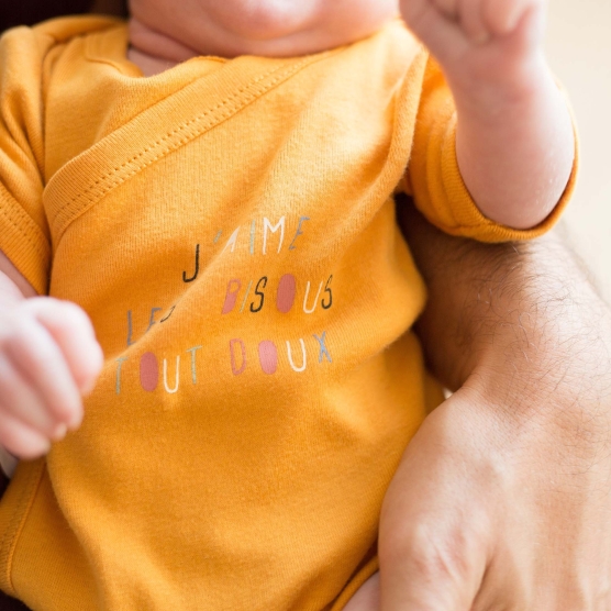 Set of two wrap-around bodysuits: mustard and white