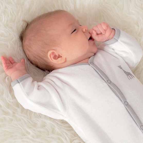 baby in white pajamas