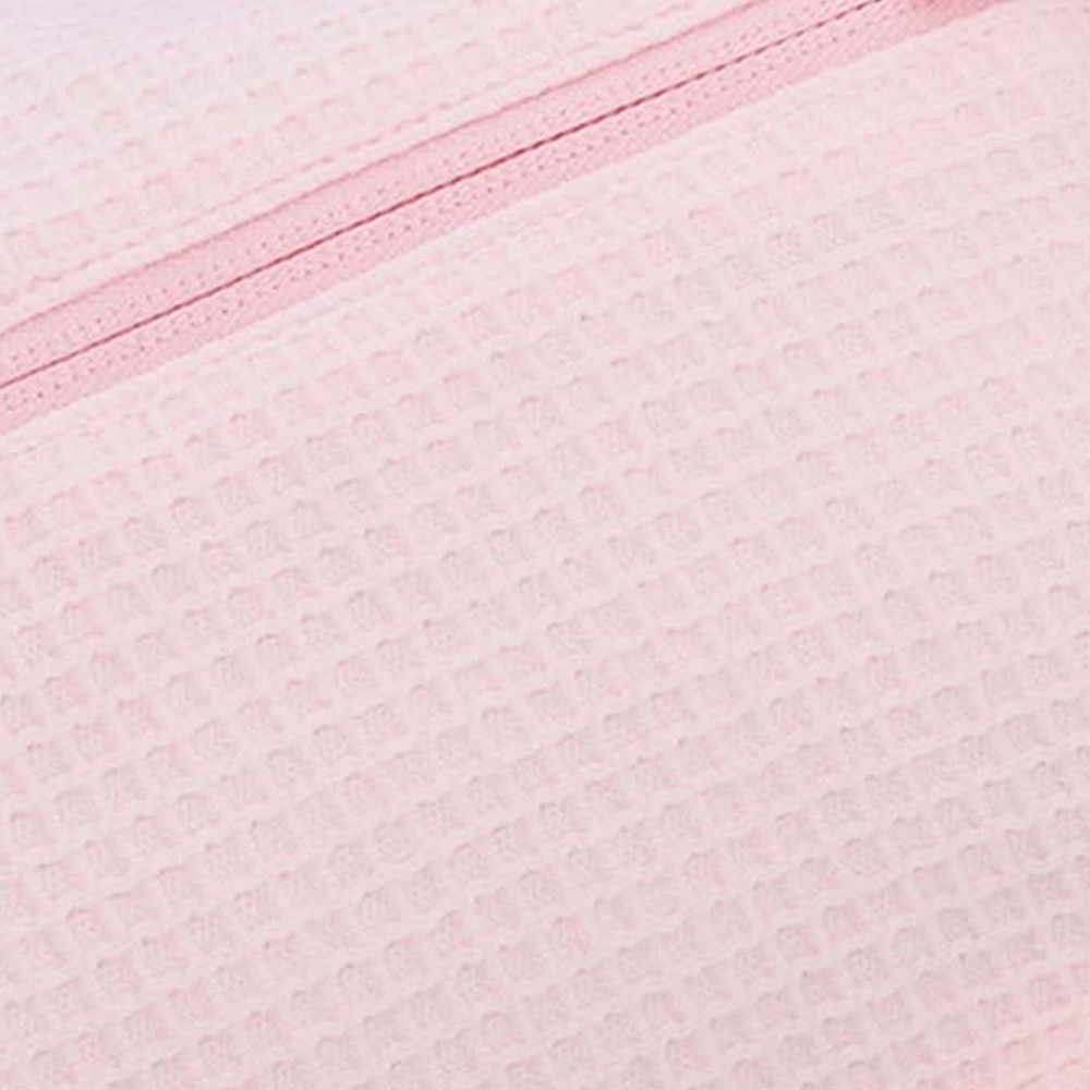 zoom sobre el material nido de abeja en algodón puro rosa