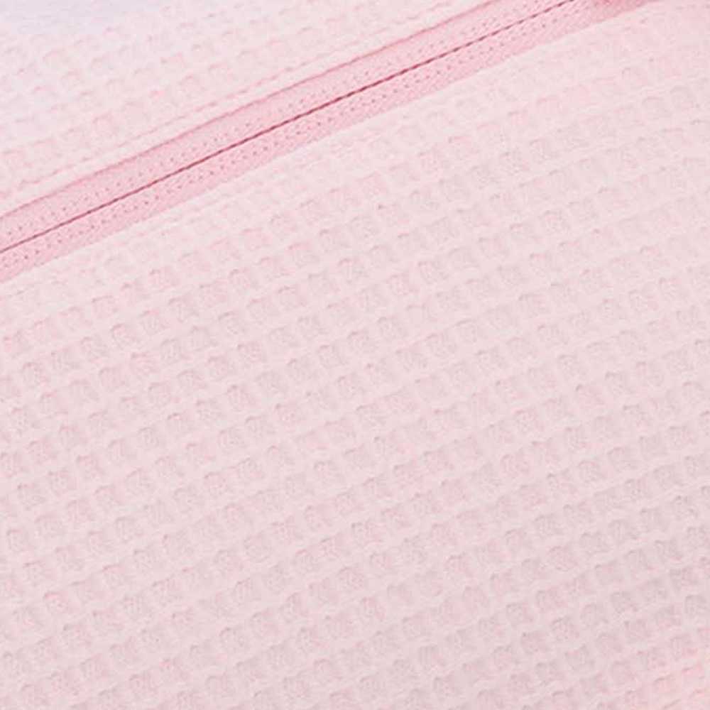 Pormenor do tecido em favo de mel de algodão puro cor-de-rosa Pormenor do tecido em favo de mel de algodão puro cor-de-rosa