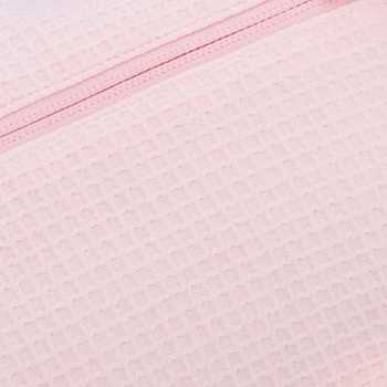 Pormenor do tecido em favo de mel de algodão puro cor-de-rosa Pormenor do tecido em favo de mel de algodão puro cor-de-rosa