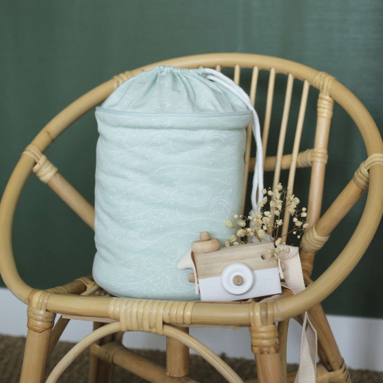 product photo of a nomadic storage basket in milky green with ocean patterns