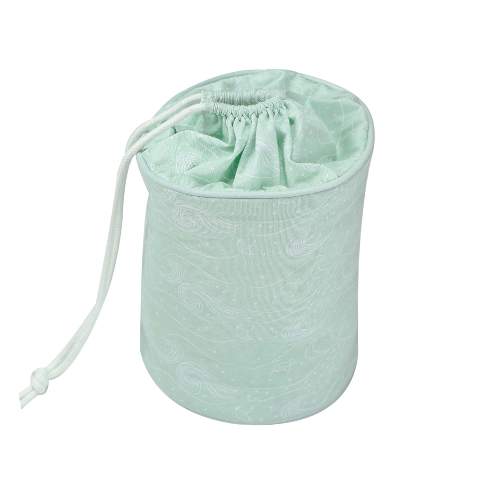 product photo of a nomadic storage basket in milky green with ocean patterns