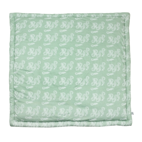 playpen mat with a white leaf pattern on a sage green background