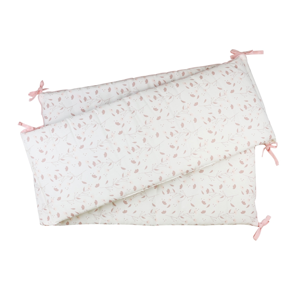 Small cotton bed bumper with a floral pattern