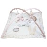Tapis d'éveil rose et blanc avec un petit bébé allongé dessus Tapis d'éveil rose et blanc avec un petit bébé allongé dessus