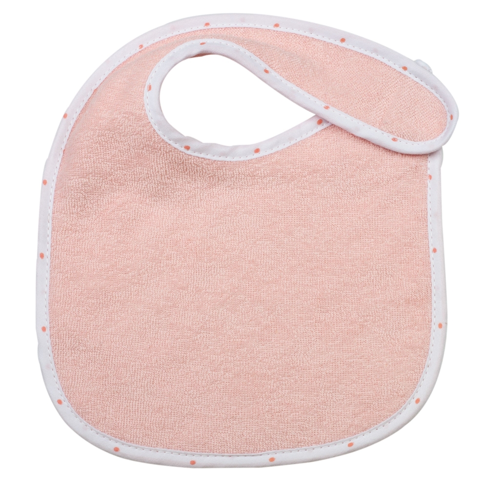 bavoir rose avec un joli liseré à pois blanc tendance